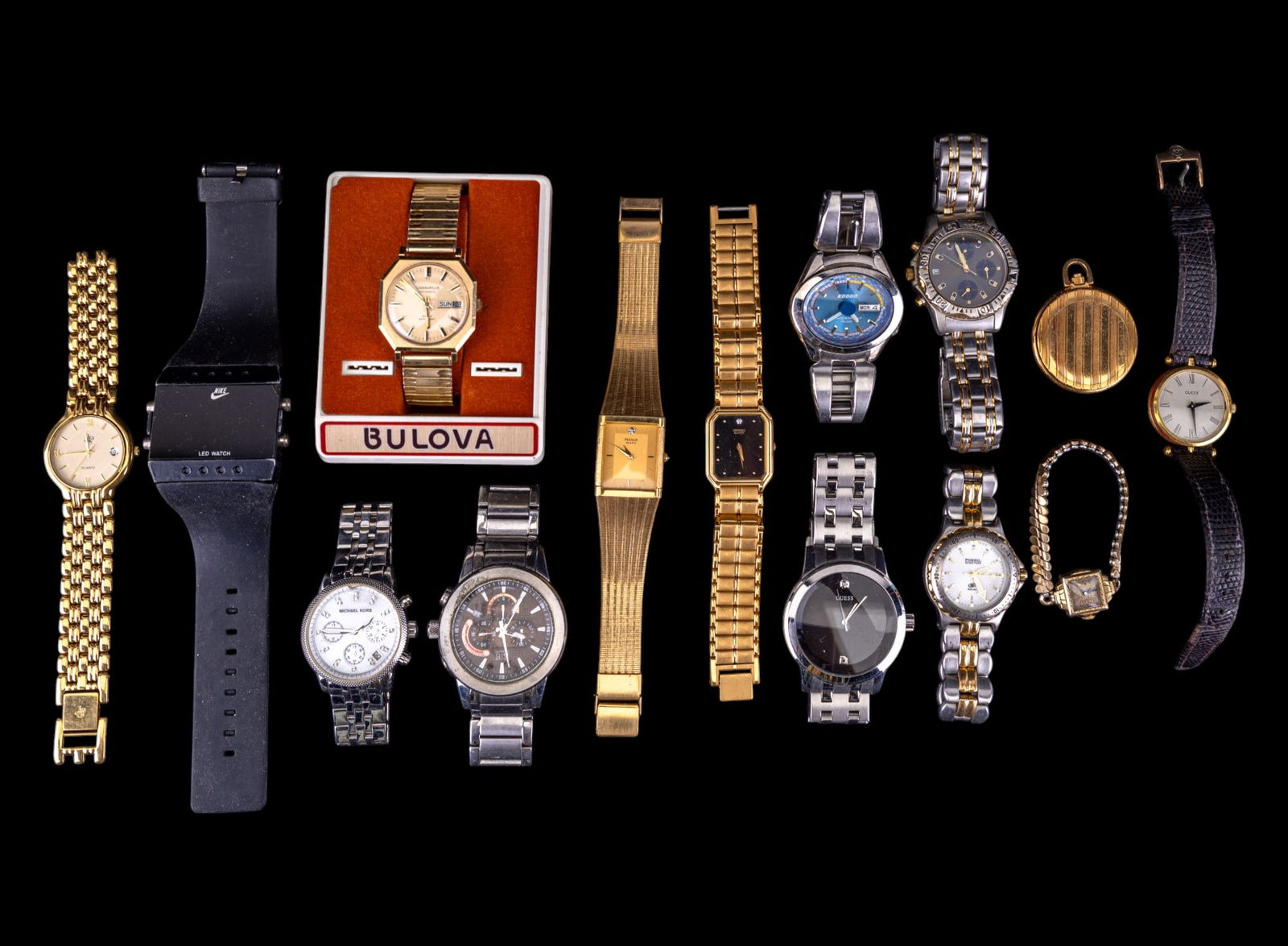 Gucci, Michael Kors, and Vintage Designer Watches: Watches include Bulova, Caravelle, automatic watches, Nike LED, Pulsar, Geneva Swiss 3-dial, Seiko, Bulova, designer Gucci, and Michael Kors. All watches sold as-found, from non-working to working.