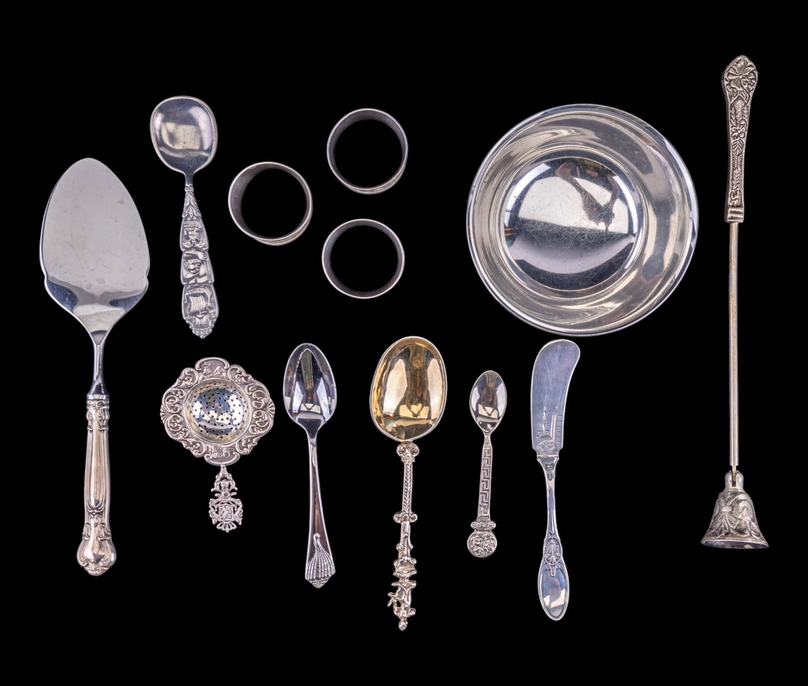 Silver-Plated Grouping: Silver-Plated Items include 3 napkin rings, a Revere bowl, tea strainer, butter knife, and 3 spoons.