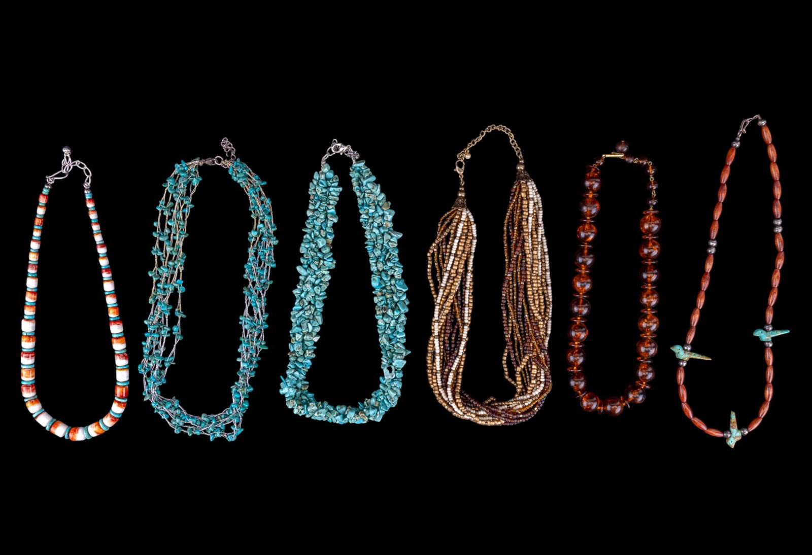 Chunky Turquoise and Other Necklaces: Multistrand rough polished turquoise necklace with sterling clasp, graduated polished shell and turquoise necklace, faux amber graduated necklace, gold and brown tone micro bead multistrand necklace,