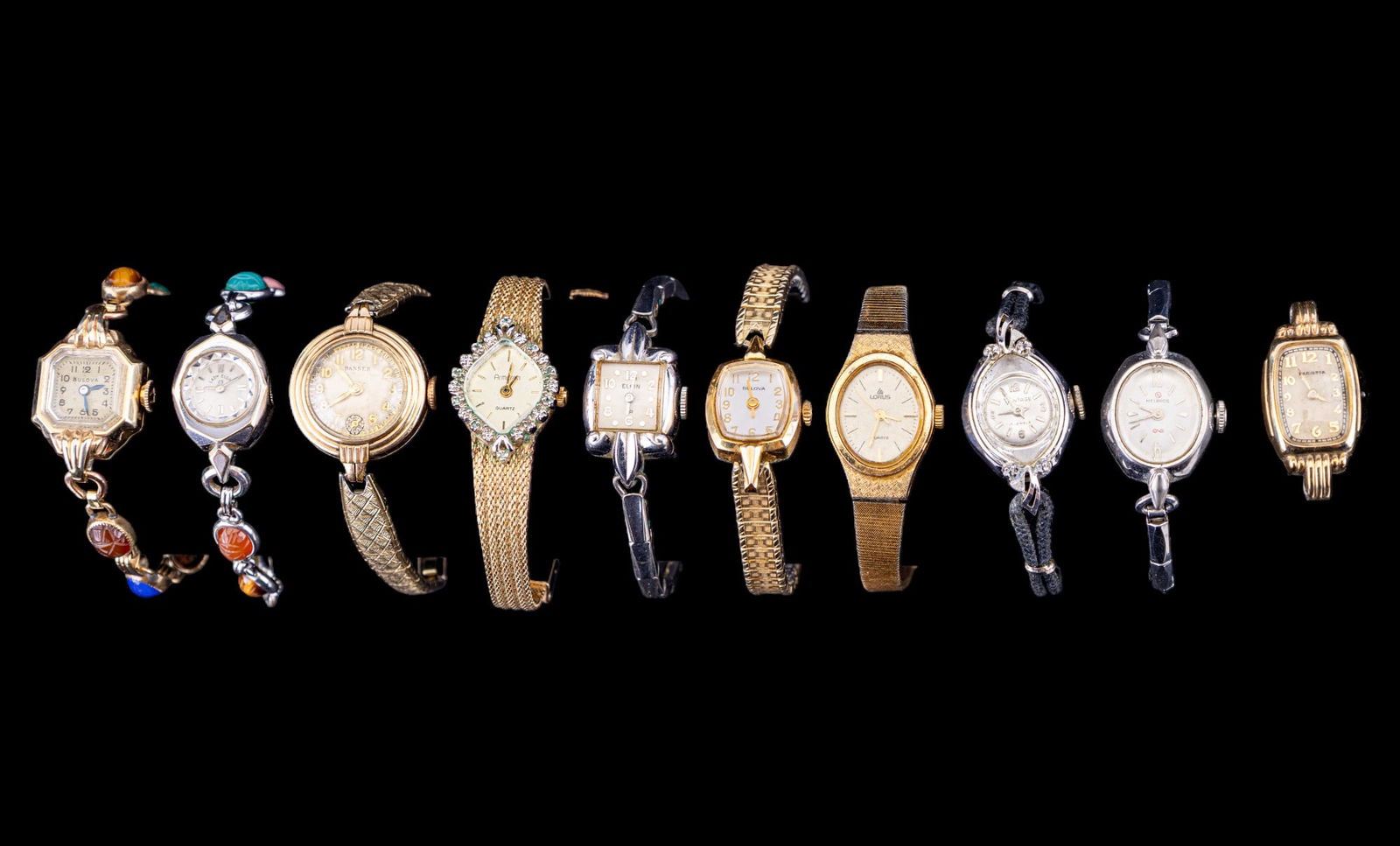 Ladies Designer Wrist Watches: Lorus gold tone V2365020, silver tone Lady Elgin 10K GF scarab band, silver tone Elgin with square face 10K RGP, Bulova with scarab band I3222235 10K GF, Bulova with stretch band 10K RGP bezel R80185,