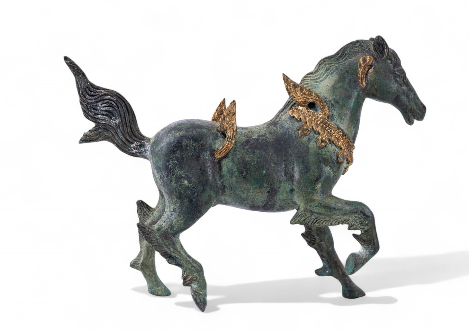 Figural Cast Metal Winged Horse: A Figural cast metal winged horse with nice petina and gilded in spots. Stands 9" high x 11.5" long x 2.5" deep. Item believed to be bronze.