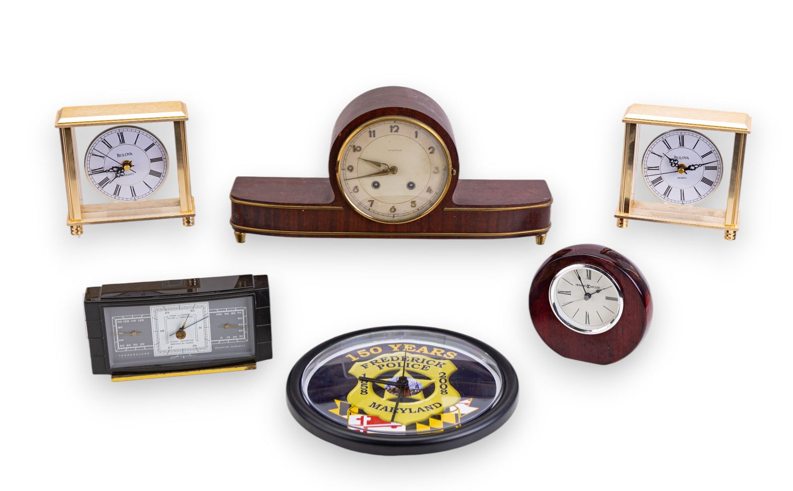 Bulova, Howard Miller + Junghans Clocks + Airguide: Pair of identical Bulova B1703 Cheryl table / desk clocks w/ gold tone finish, a Howard Miller desk clock w/ polished wood, a Junghans 4 Jewels mantel clock made in Germany w/ 2 clock keys, a Frederic