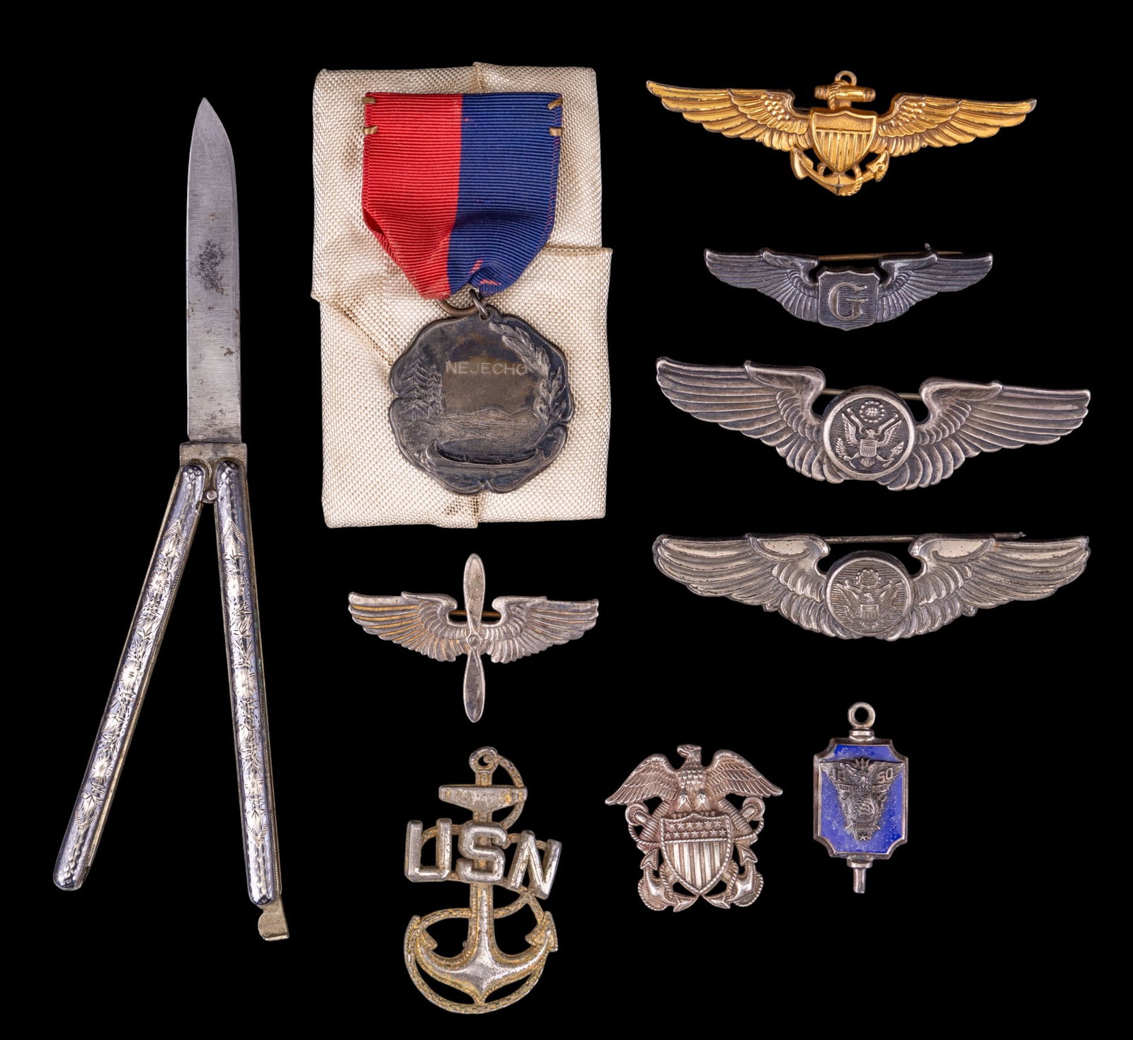Sterling Military Badges and Pins: A collection of sterling silver U.S. Military badges and pins featuring the Prop and Wings for the U.S. Army Air Force of WW2, two 'Wings' USAF Aircrew badges, Navy Officers Garrison Cap badge, 1950 K