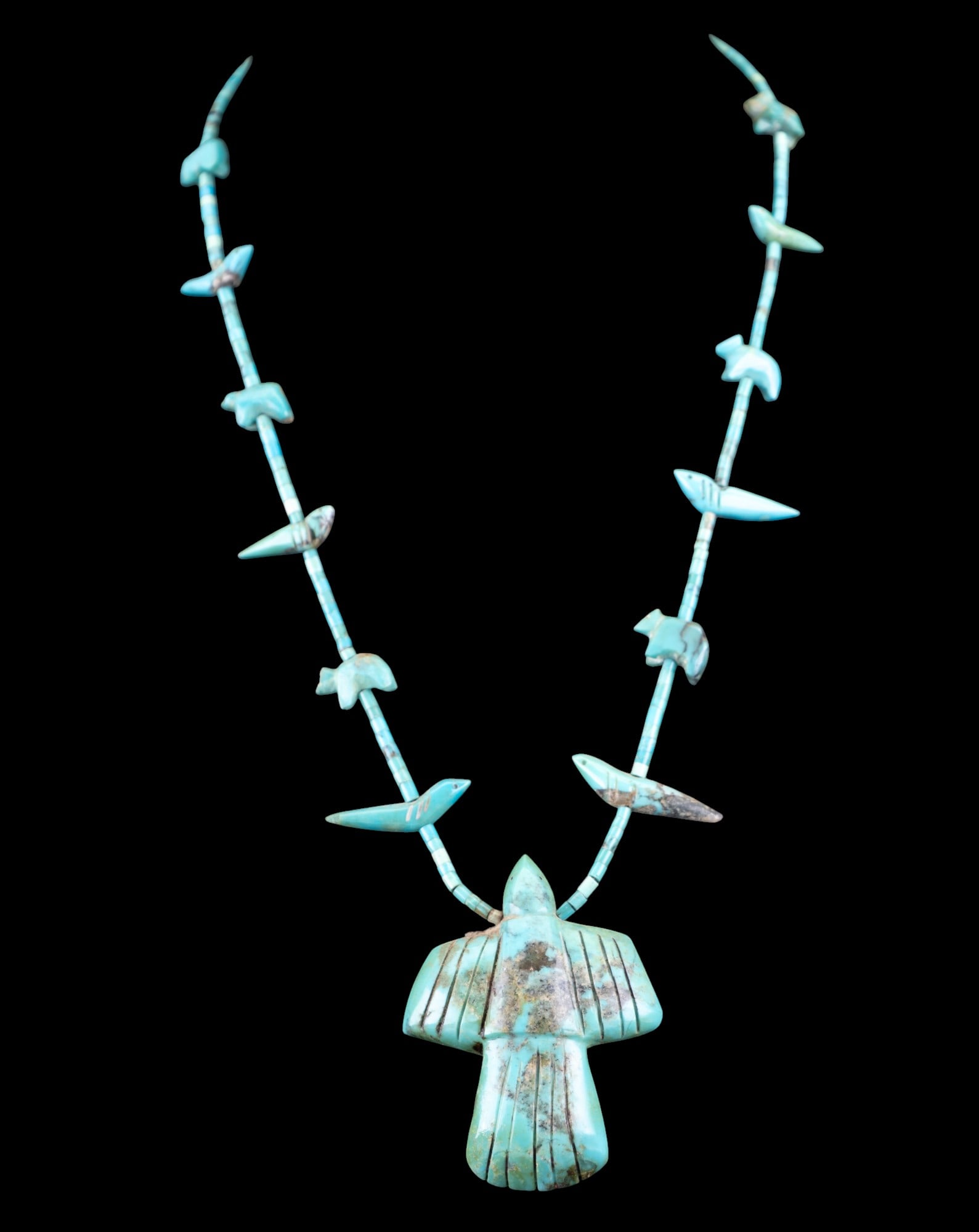 Native American Early Turquoise Necklace: Very early Native American turquoise fetish necklace with a large eagle pendant, bear and bird carved beads.