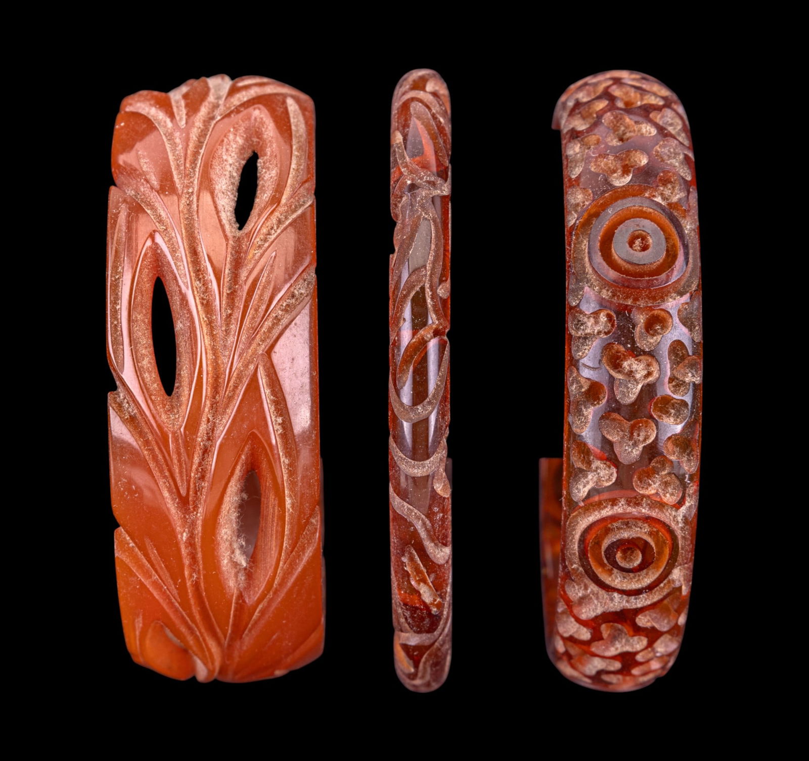 Vintage Bakelite Bracelets (3): One carved apple juice Bakelite bangle bracelet and two butterscotch carved Bakelite bangle bracelets.