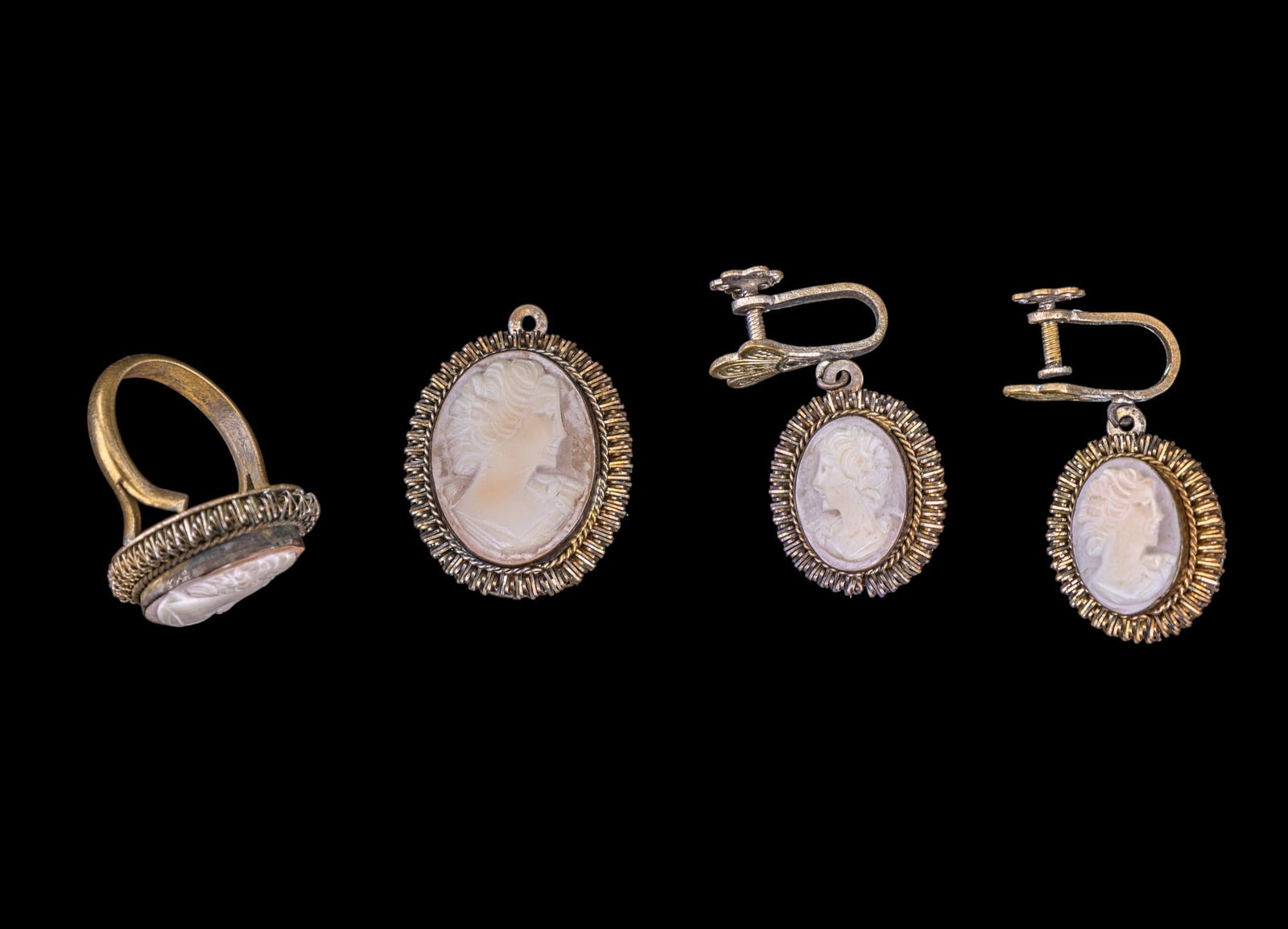 Victorian .800 Silver Shell Cameo Jewelry Set: A set of Victorian .800 silver carved shell cameo jewelry consisting of a pendant, a pair of screwback earrings, and a ring. Items are marked "S 800" on backs. Ring is size 5.5.