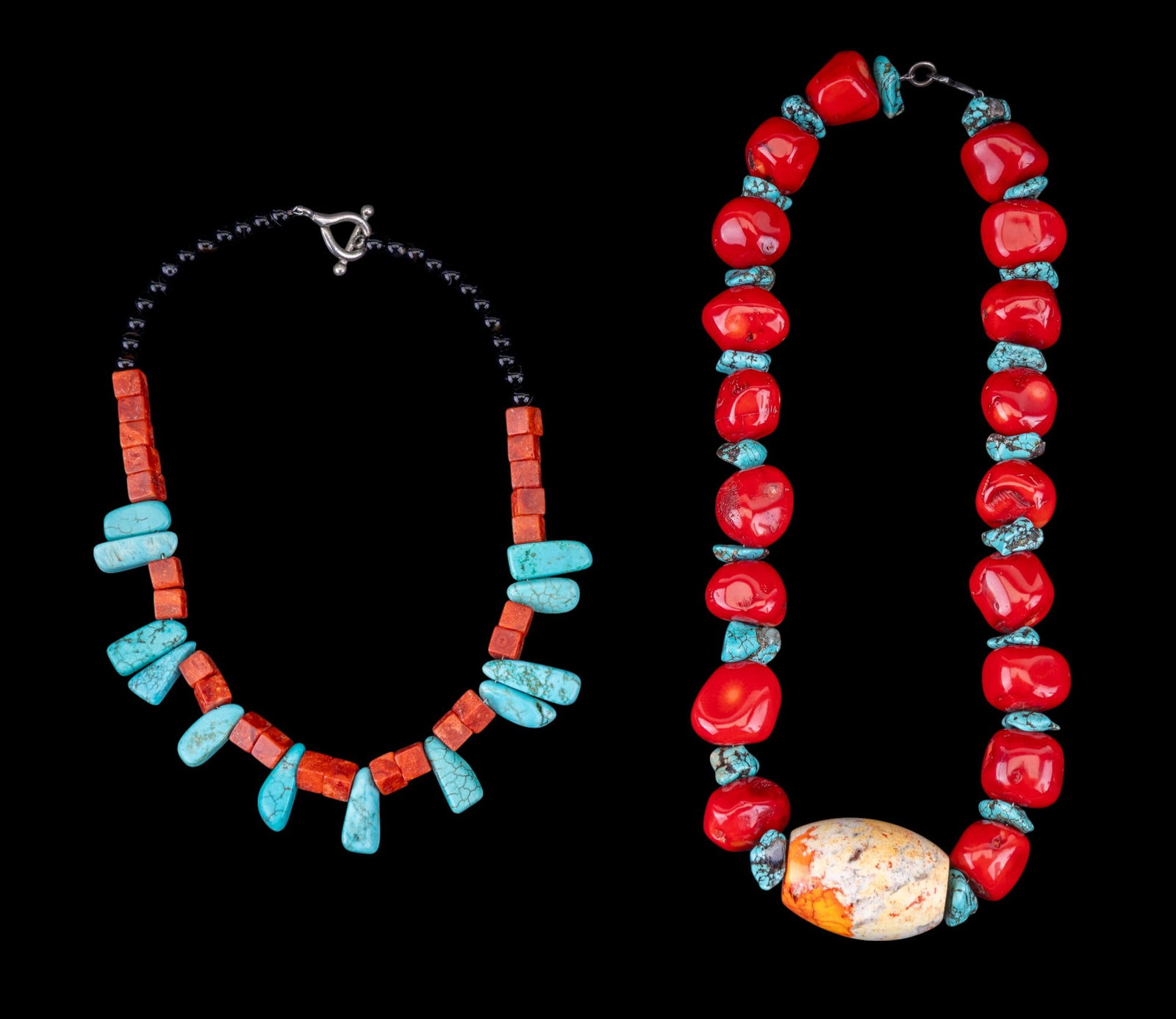 Chunky Polished Coral Turquoise Bead Necklaces: Grouping of two natural stone necklaces. Consists of a 20.5" long chunky polished red coral and turquoise chunk necklace with polished central stone, and a howlite + cubic coral necklace with black st