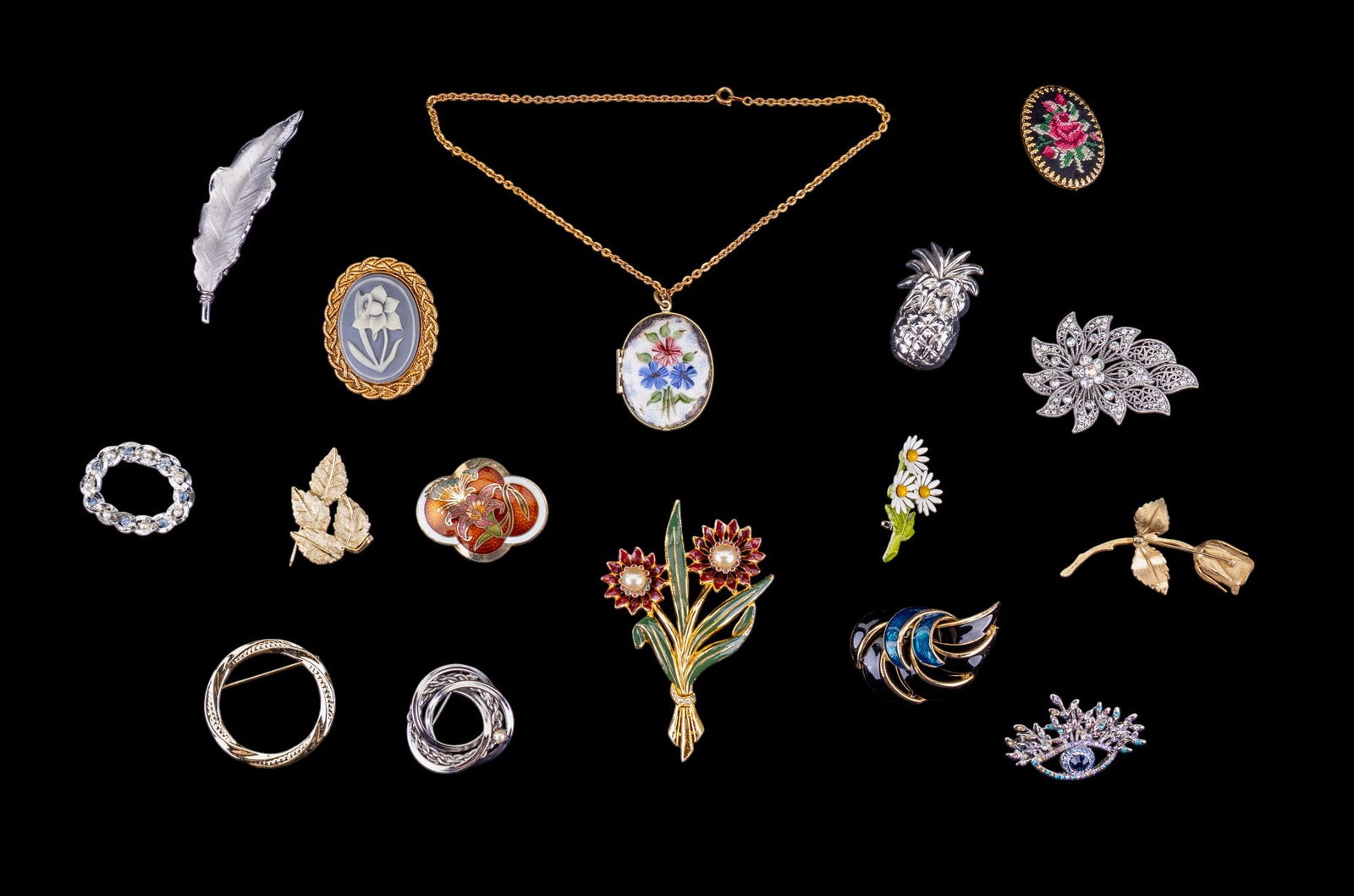 Monet, Coro, Givenchy, + More Designer Brooches: Collection of 15 brooches including a Monet silver tone floral brooch w/ clear rhinestones, a Coro silver tone leaf, a Givenchy enameled gold tone leaf, a Giovanni gold tone rose, a Best silver tone p