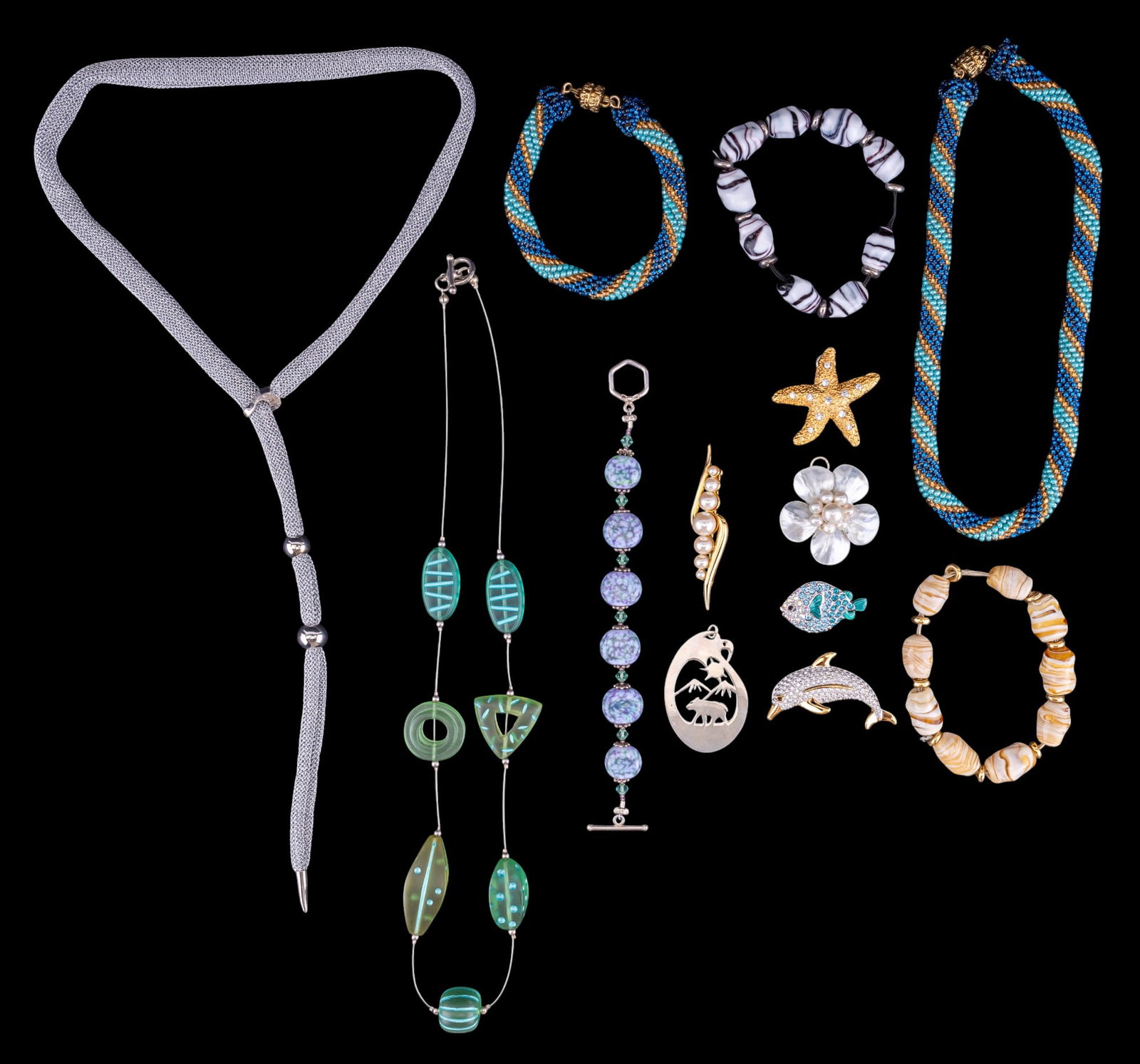 Branded Brooches and Beaded Necklaces: Branded Brooches and Beaded Necklaces including two Swarovski Brooches (dolphin and fish), a Monet Faux Pearl Brooch and another brooch (as found with glue repair) in the form of a starfish. Collectio