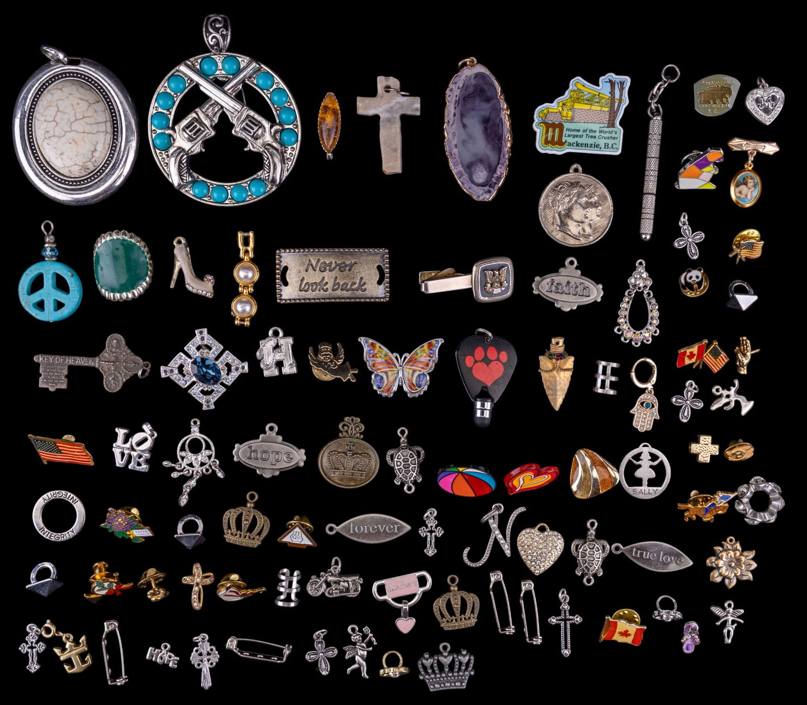 Pins, Pendants, + Brooches Jewelry Group: Extensive collection of pins, pendants, and brooches in various designs, materials, and themes. Includes one with a clear hallmark and a Christmas-themed goose. The collection features crosses, peace 