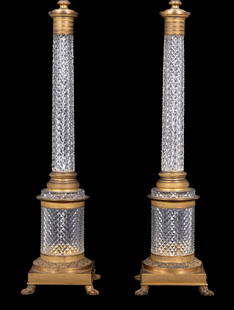 Fine Crystal Baccarat Style Empire Table Lights: A pair of fine crystal baccarat style empire table lights measuring approx. 35.5" high with gilt bronze and handmade crystal. Four footed square base with 4 toes. Item in excellent condition as seen i