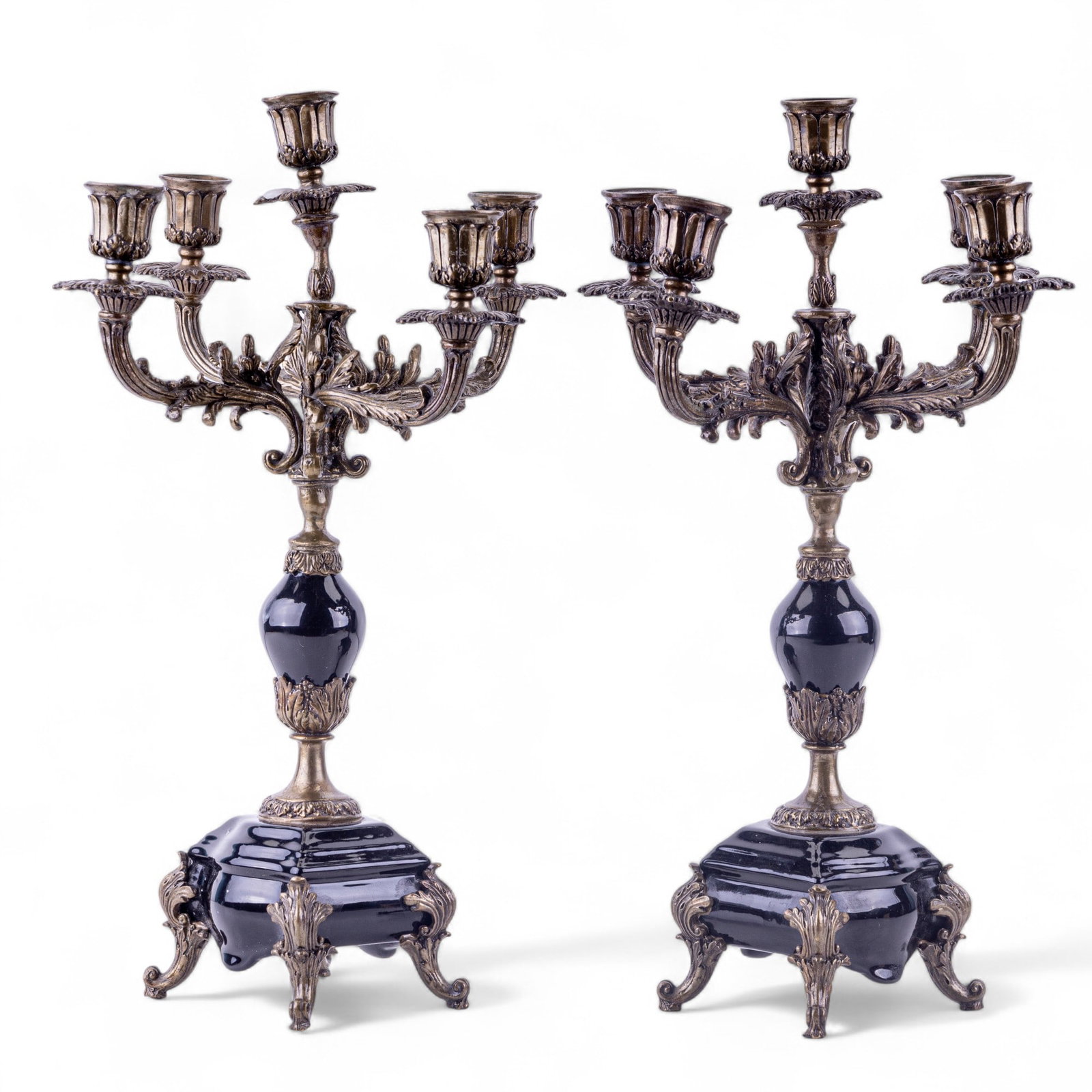 Antique Bronze + Black Porcelain Candelabras: A pair of bronze and black porcelain candelabras measuring approx. 6" diameter x 17.5" high. Some arms of 5-arm candelabra bent or crooked. Highly engraved bronze.