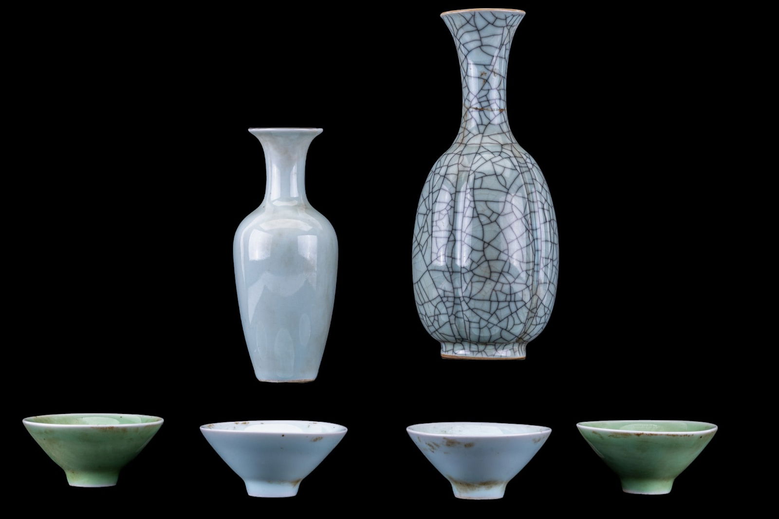 Celadon Vases and Tea Cups: A collection of celadon porcelain featuring a vase with crazing, marked on the bottom, note chip near rim, and repaired break in the neck, measures approx. 8.75" H, small light green celadon amphora v