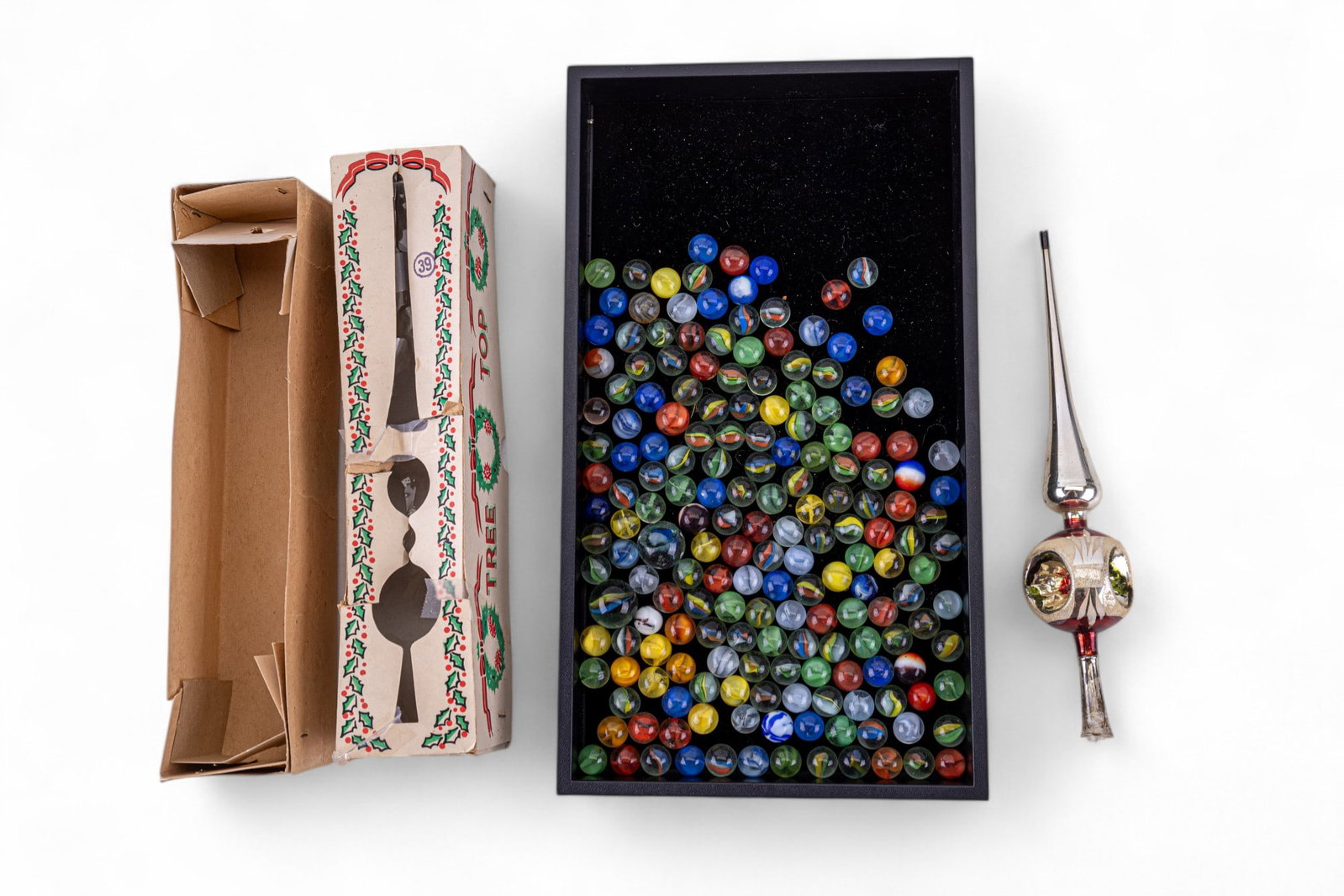 Vintage Glass Marbles: A collection of vintage blown glass marbles and a vintage glass tree topper made in Poland, date stamped on the bottom 44/3/8.