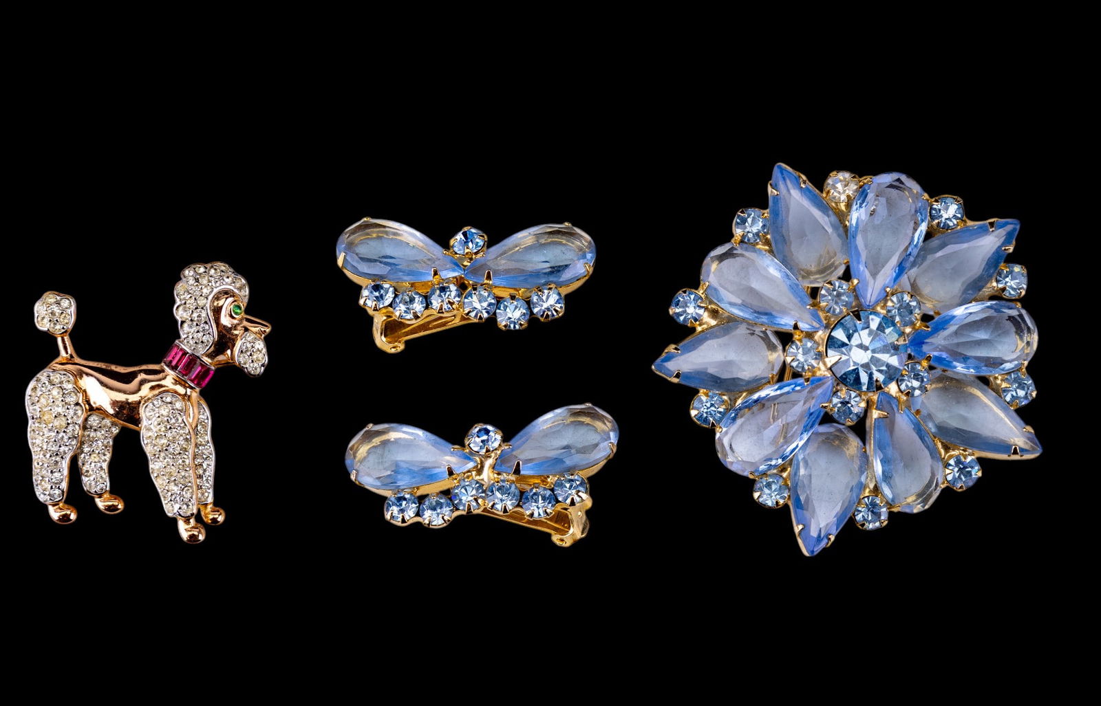 Trifari and Vintage Jewelry: Trifari enamel and crystal standing poodle brooch and unsigned multi hue brooch with matching earrings, c. 1940s.