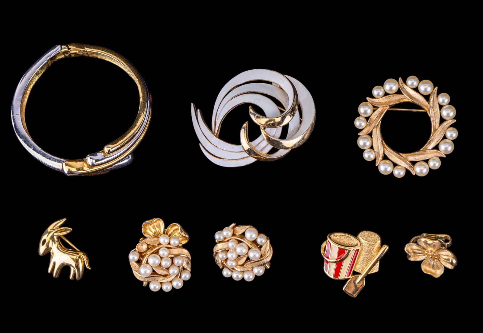 Trifari Jewelry Collection: Trifari pearl and gold tone brooch with matching earrings, enamel brooch, dogwood earrings, sand bucket pin, two tone bracelet, and more.