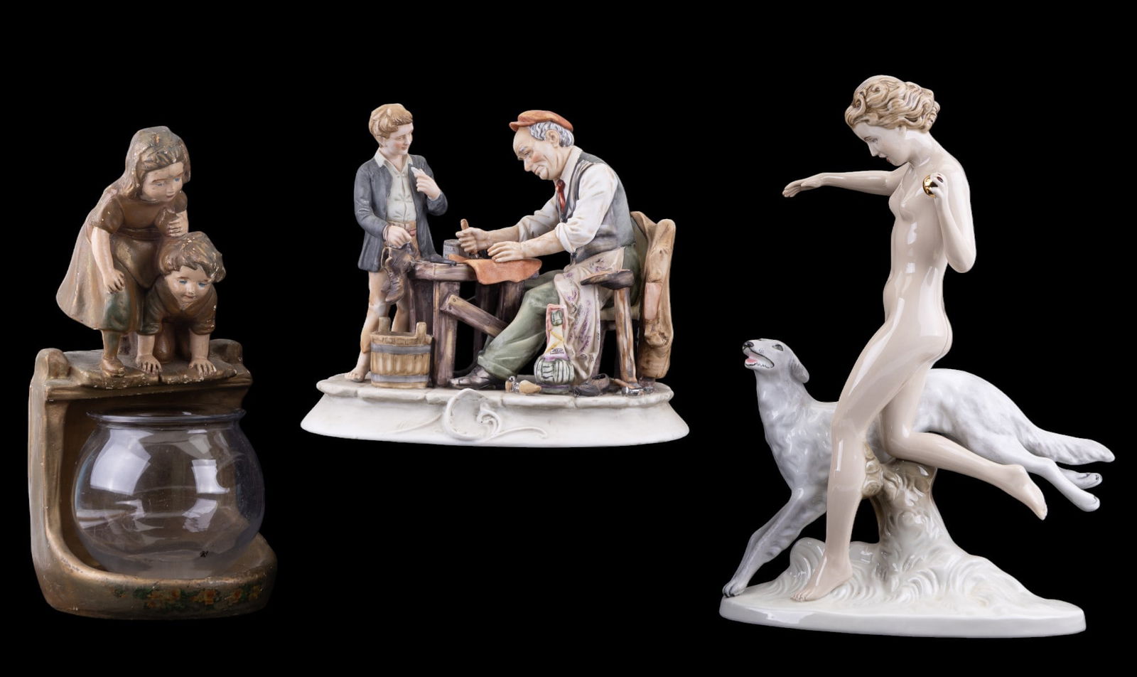 Capodimonte + Royal Dux Figurines, Fish Bowl Stand: A Capodimonte bisque figure measuring approx. 9" high depicting a cobbler, and a figural fish bowl stand made from gilt and painted wood. Lastly, a Royal Dux figurine depicting a nude woman and her gr