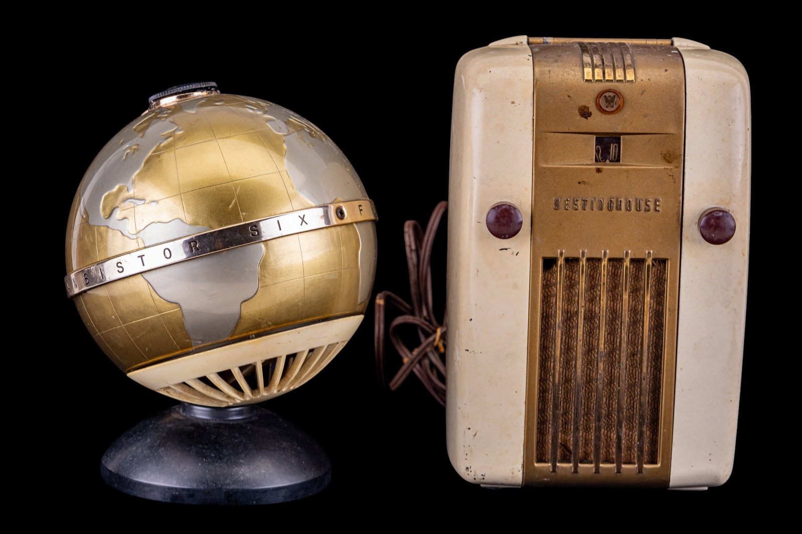 Vintage Westinghouse and Transistor Radios: Vintage mid century Westinghouse H-125 'Little Jewel' made popular by it's handle, small size, and refrigerator like design, and a vintage figural globe shaped transistor six Fleetwood radio, c. 1950s
