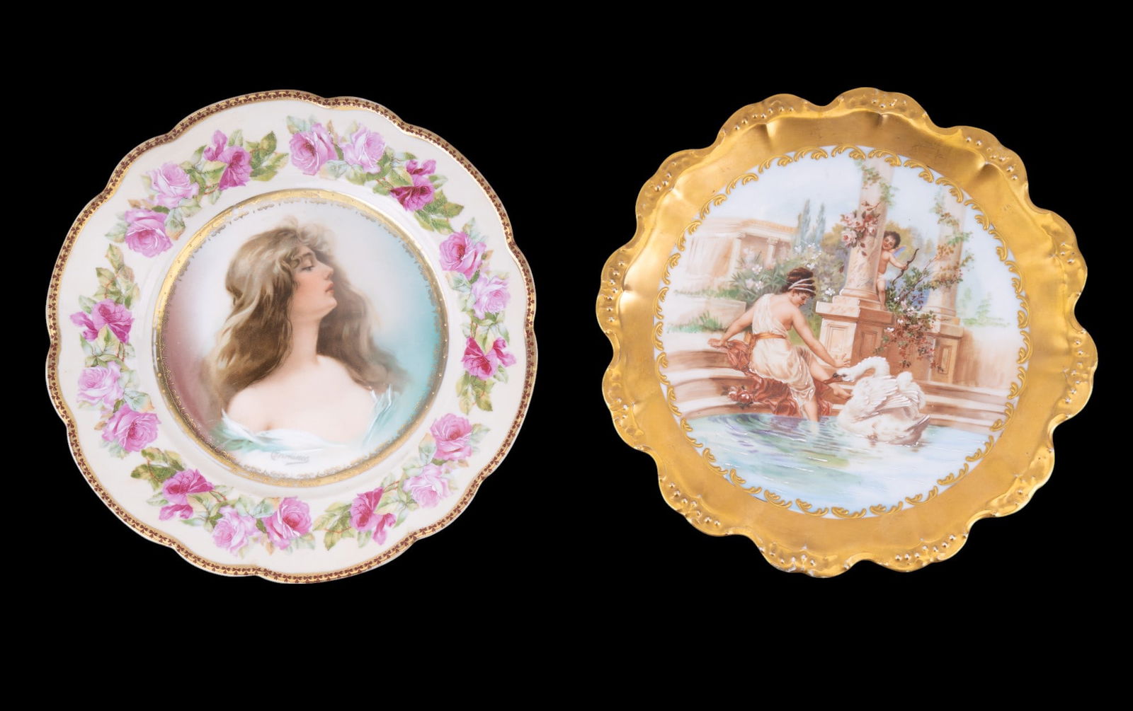 Pair of Limoges Hand Painted Plates: Limoges antique porcelain decorative wall plates. These two plates are Pair of hand painted Limoges plates. One depicting a woman in fountain with swan and cherub nearby with gold gilt rim and the oth