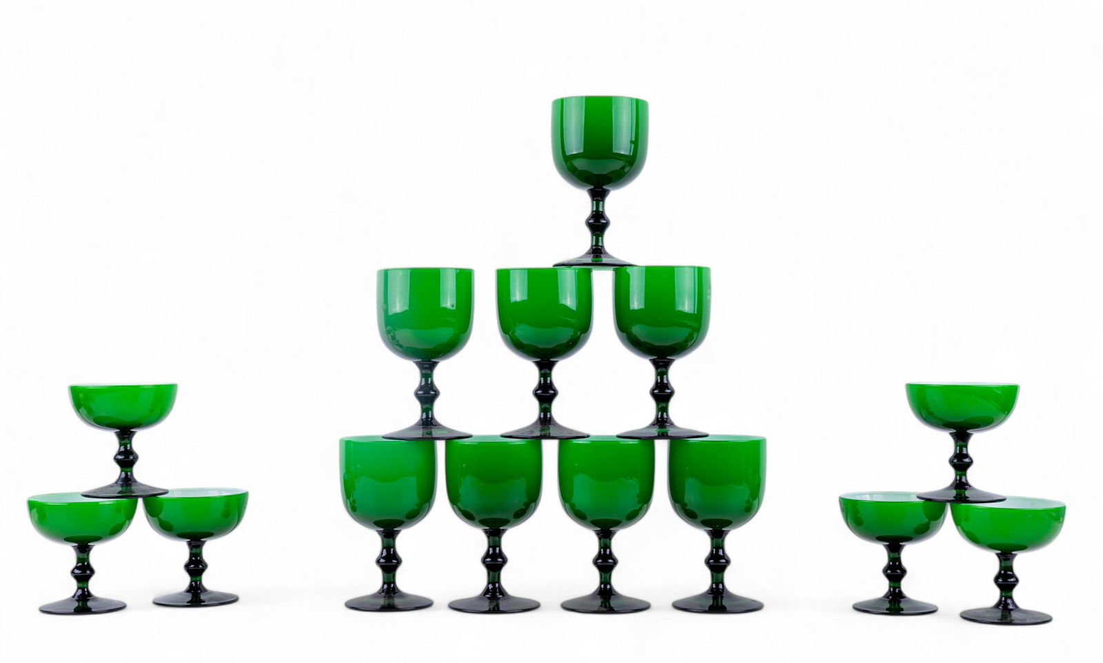 Carlo Moretti Green Glass Sherberts, Wine Glasses: Grouping of Carlo Moretti vibrant green Italian glasses with six sherberts and eight wine glasses. Glass in good condition as seen in photography. Sherberts measure approx. 4" high and glasses measure