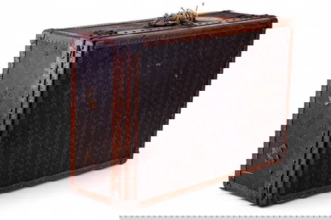 Louis Vuitton Hard Case Leather Suitcase: An early Louis Vuitton hard-sided leather suitcase measuring approx. 17" high x 25.5" wide x 8.5" deep. Louis Vuitton label on inside has serial number 793537. Handle not present, vintage travel label