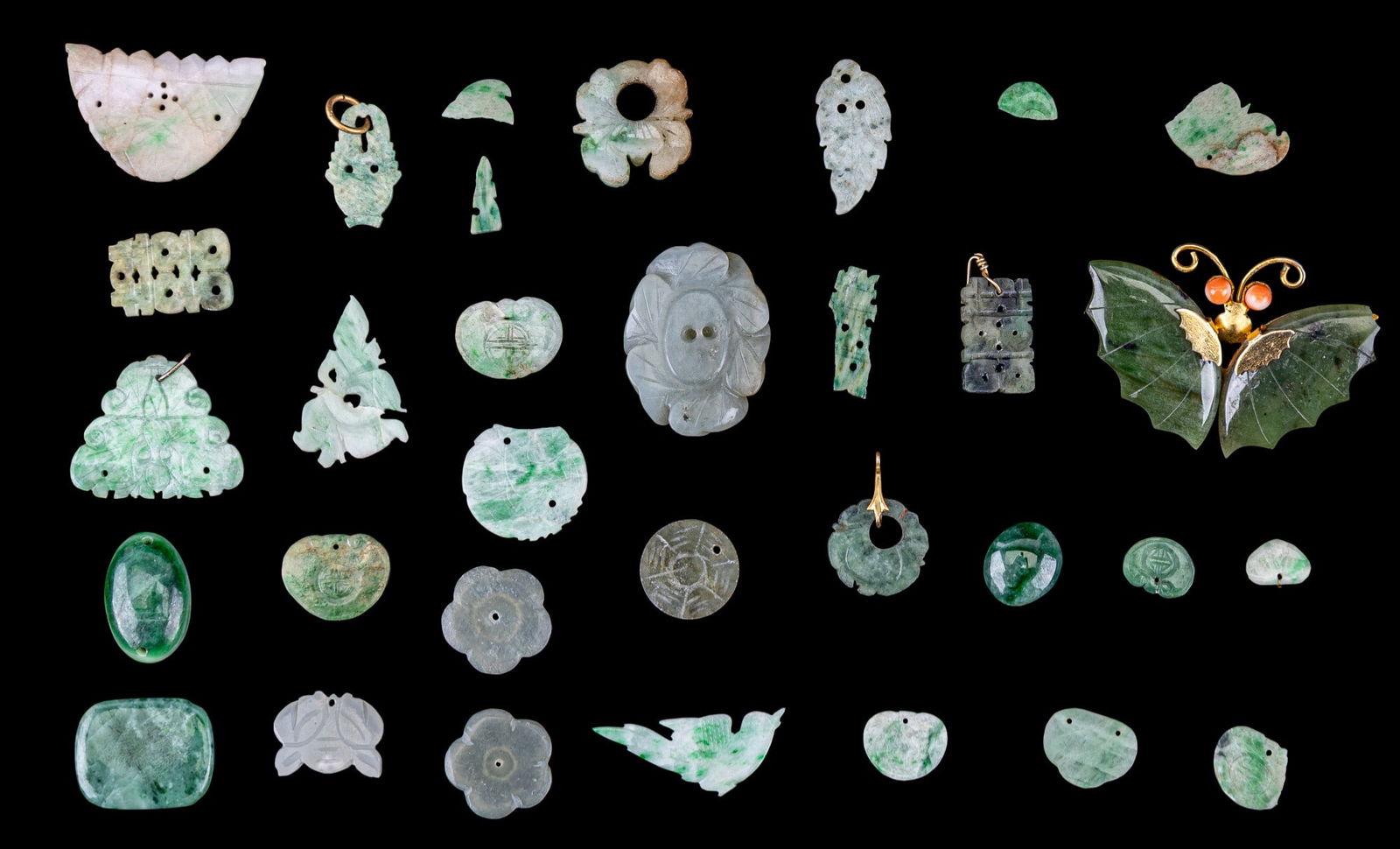 Carved Green Hardstone, Jade Butterfly: A grouping with many pieces of jade & green hardstone. Includes a spinach jade butterfly broach, carved jade flowers, an animal face, and more green hardstone.
