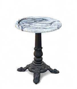Iron and Marble Pedestal Bistro Table: Ornate black iron pedestal bistro table and polished black and white marble top, heavy and may require arrangements for pick up, 24" dia x 29" H