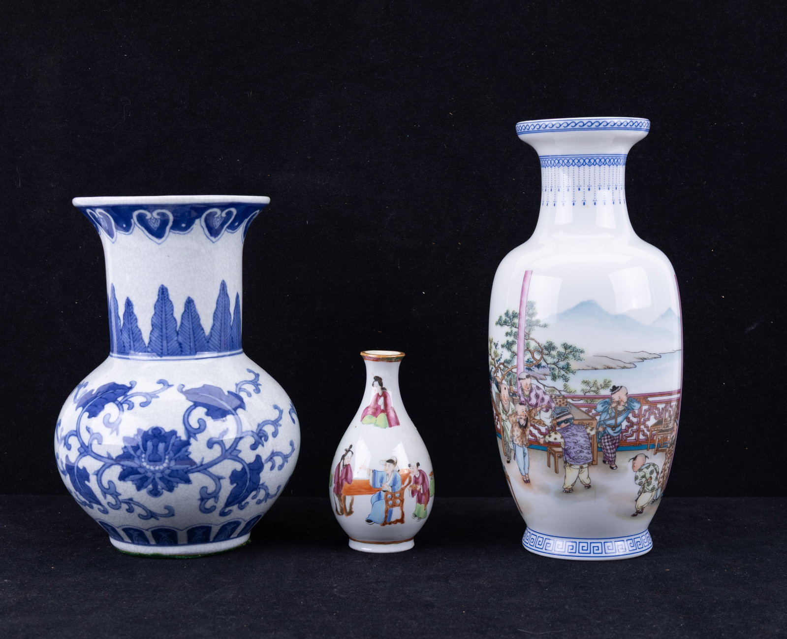 Antique Mandarin and Contemporary Chinese Vases: A small hand painted antique Mandarin porcelain vase, 5.5" H, a blue and white contemporary crazed porcelain vase, marked 'Made in China', 10" H, and a contemporary porcelain Famille Rose vase depicti