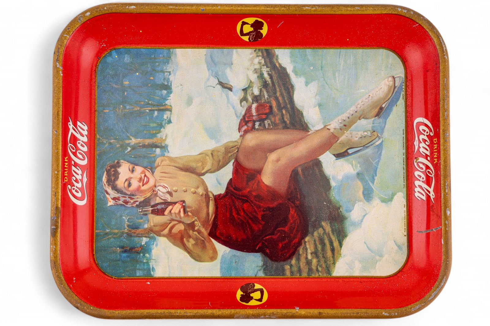 1941 "Drink Coca-Cola" Ice Skater Tray: A vintage 1941 Drink Coca-Cola ice skater tray measuring approx. 10.5" x 13.25". Some wear to paint as seen in photography.