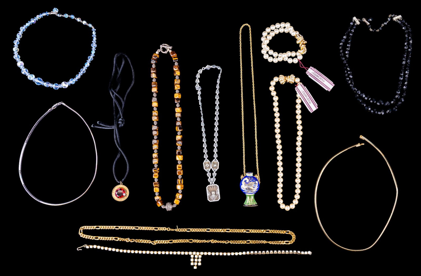 Art Deco, Cloisonne, and Designer Necklaces: A silver tone Art Deco necklace, a Cloisonn? flask pendant, a black crystal double strand necklace by Laguna, a Marvella pearl necklace with matching two strand bracelet, a Monet Figaro chain, a tiger