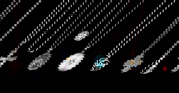 Sterling Silver Chains and Pendants: A collection of 7 sterling silver chains, 6 with sterling silver pendants, featuring a gold tone and green hardstone medallion, a Catholic charm, rhinestone, and cabochon, sizes range from 14" to 24"