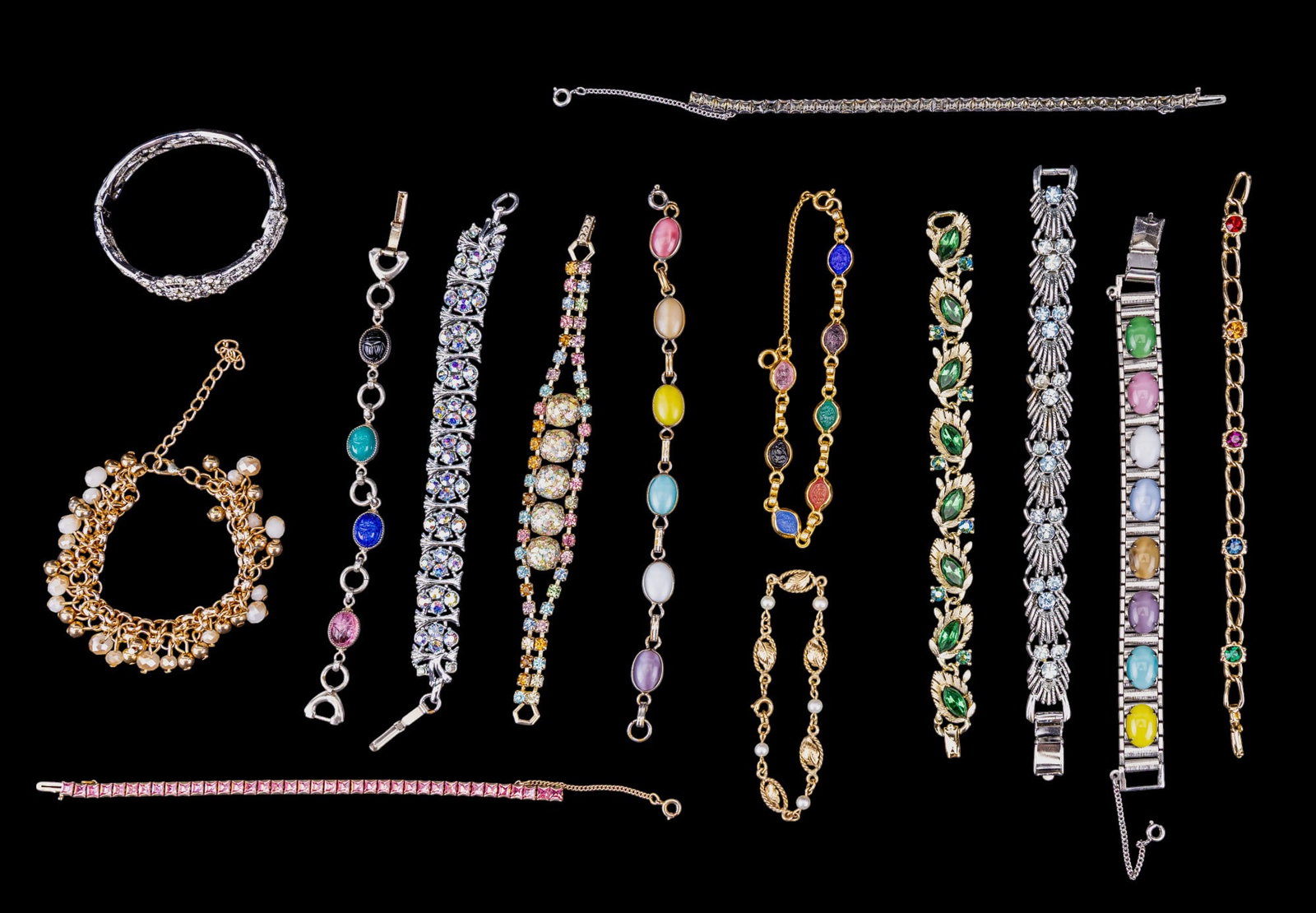 Vintage Designer Costume Bracelets: A collection of vintage designer costume bracelets featuring Lisner, Sarah Coventry, Coro, and others.