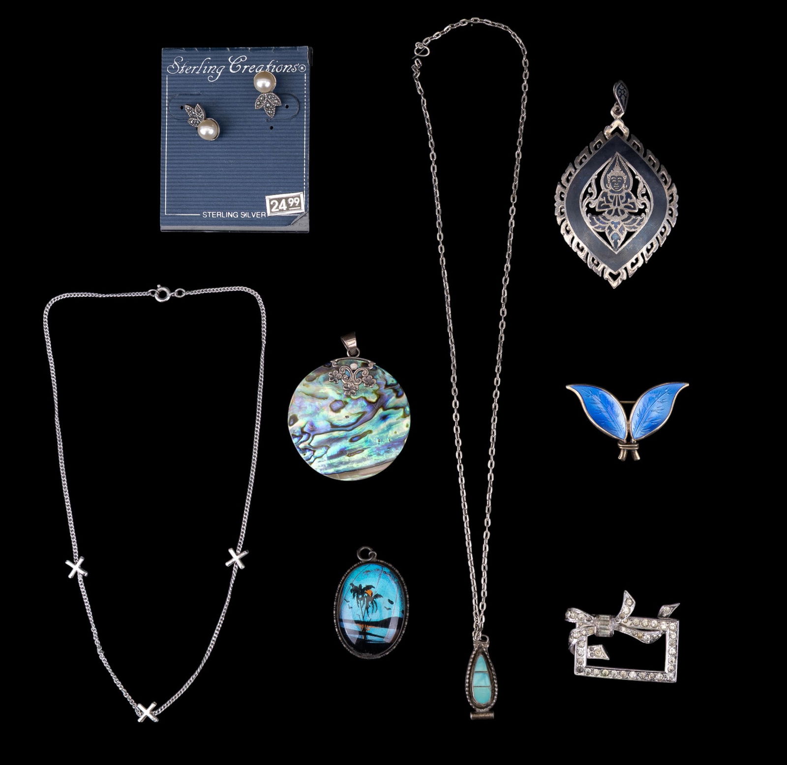 Norwegian, Siam, Zuni, and other Sterling Jewelry: Siam sterling pendant, abalone pendant, signed, painted butterfly wing cabochon pendant, sterling, pearl, and marcasite stud earrings, Dorsons Art Deco brooch, sterling chain with X charms, Zuni turqu