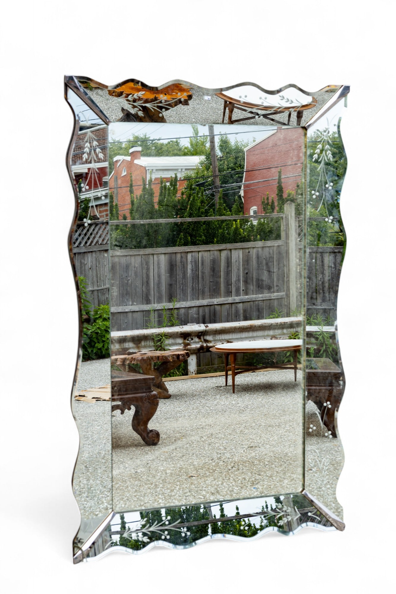 Venetian Glass Mirror >5' H: A Venetian glass mirror with etched mirror frame. Item measures approx. 64" high x 40.5" wide x 2" deep.