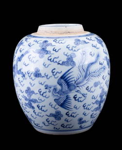 19th C Blue & White Porcelain Ginger Jar: A blue and white porcelain ginger jar with swirl design, phoenix and dragon motifs. Lid not included. Jar measures approx. 10" H.