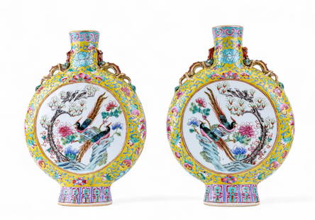Pair of 19C Famille Rose Porcelain Moon Flasks: A pair of 19th century Famille Rose porcelain moon flasks with chop mark on bottom, imagery depicts the 8 Immortals on one side and phesants on the other, figural dragons can be seen on neck of flasks