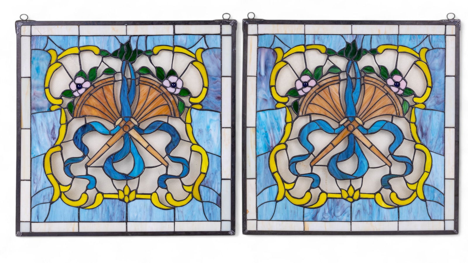 Slag Glass Mosaic Window Panels (2): Slag glass mosaic window panels with floral motif. Each panel measures approx. 22.5" x 23". Slight cracking to some glass on both windows. No visible loss.