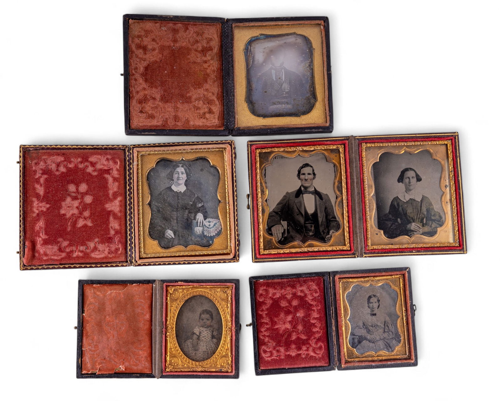Leather Case Ambrotypes: A leather case double Ambrotype, two small single sided Ambrotypes, one with a baby and the other with a young lady, and two 3.75" Ambrotypes, one with a man and the other with an older woman, all in