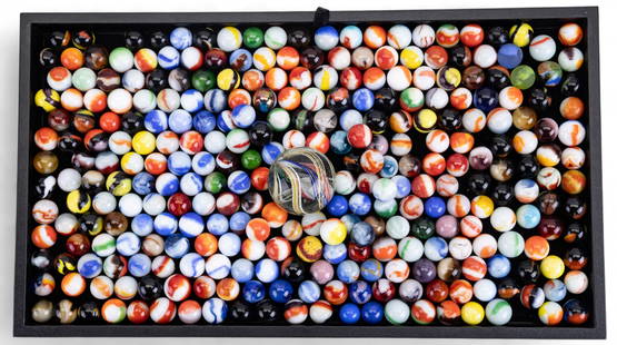 Oversized Glass Marble Shooter and Marbles: Oversized glass marble shooter with colored swirling, sized similar to a jawbreaker, approx. 2" diameter and an assortment of vintage glass marbles.