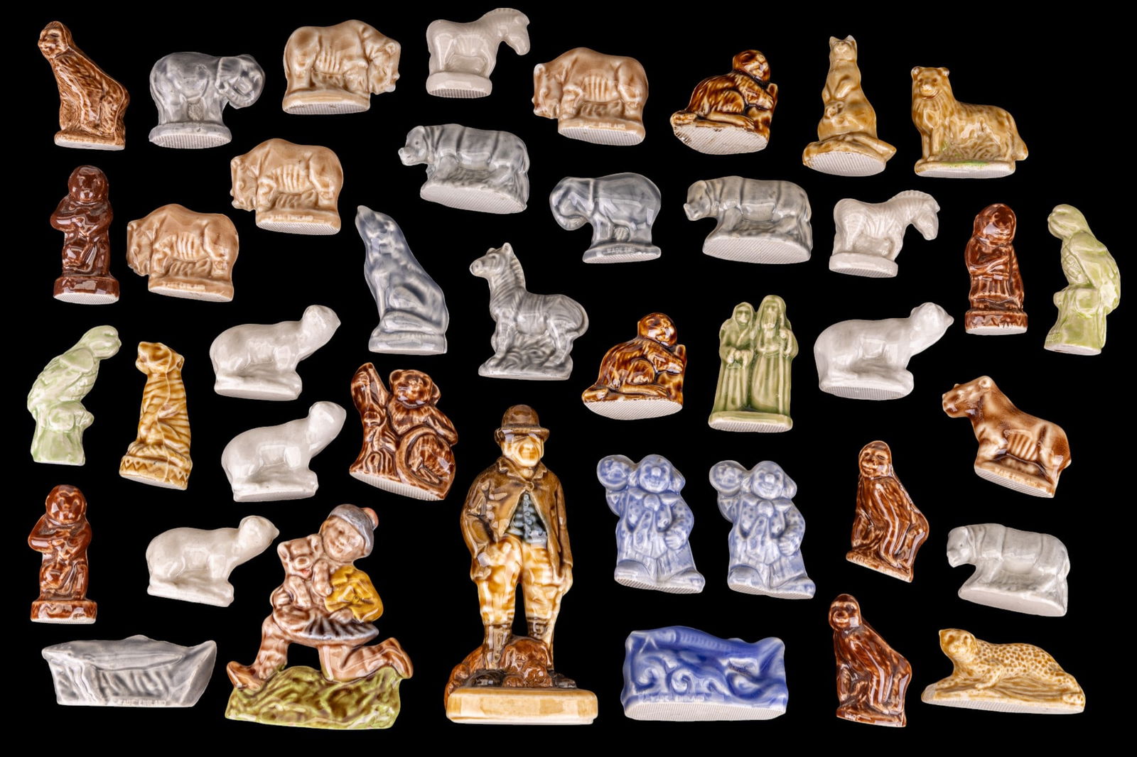 Wade England Whimsies (40): A collection of 40 glazed ceramic Wade England whimsies, also including two figurines from the Nursery rhyme series.