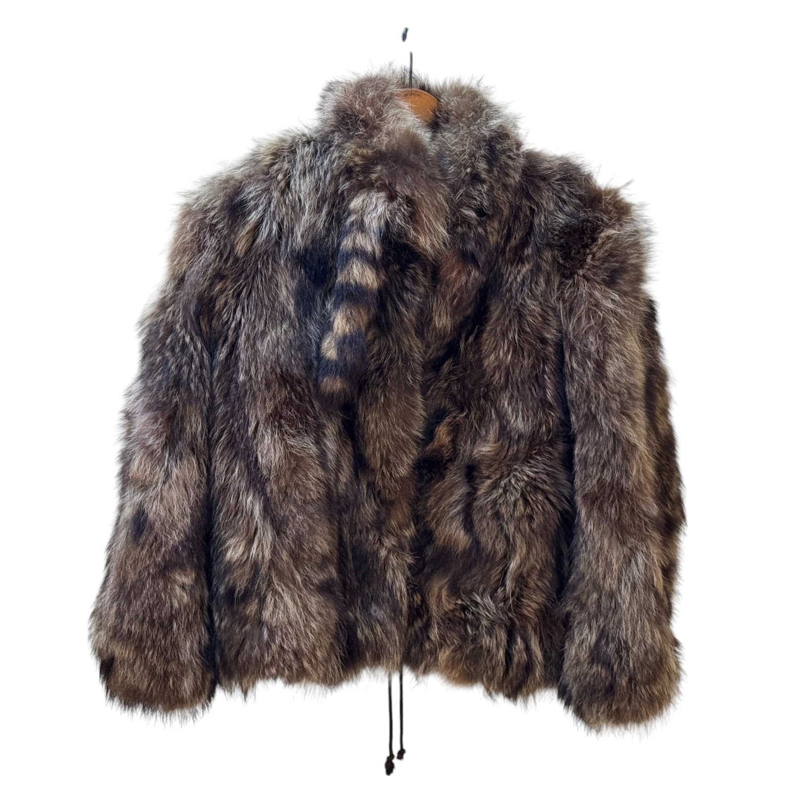 Racoon Fur Coat: A Racoon fur coat with silk/satin lining with 2 racoon tails sticking out of shoulder, no visible tag. Shoulders measure approx. 22" across.