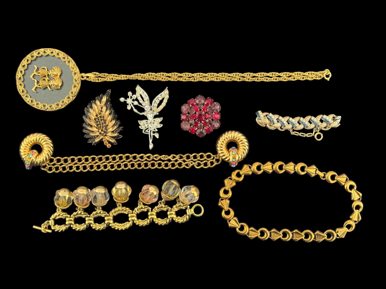 Early Kramer, Coro, and Vintage Jewelry: Signed Kramer red to purple brooch, Coro goldtone double-chain pendant, early unsigned pin, large modern necklace, and more.