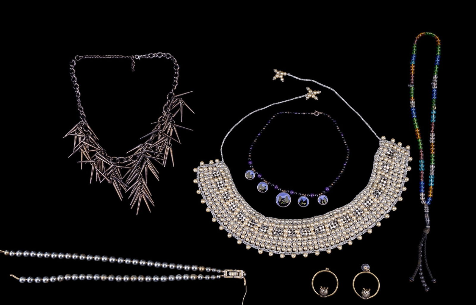 Contemporary Jewelry Collection: Black onyx and amethyst polished bead necklace with sterling clasp, and enamel black cat charms with sterling rims, glass bead prayer necklace, Trifari faux pearl two strand necklace white rhinestone