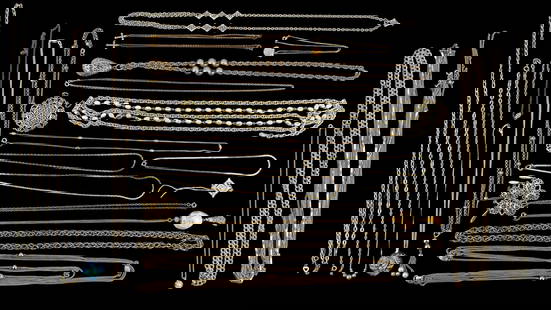 Costume Necklaces and Chains w/ Trifari: A collection of gold tone and silver tone chains and necklaces, featuring a gold tone and pearl Trifari necklace and pendant, oversized silver tone pendants, multi strand necklaces, and others.