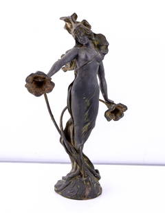 Art Nouveau Cast Statuette of Woman, Signed: A 21" high Art Nouveau cast Statuette of a robed woman with signature on bottom reading "Ant Nilson" on base. Flowers present on on either side of woman.
