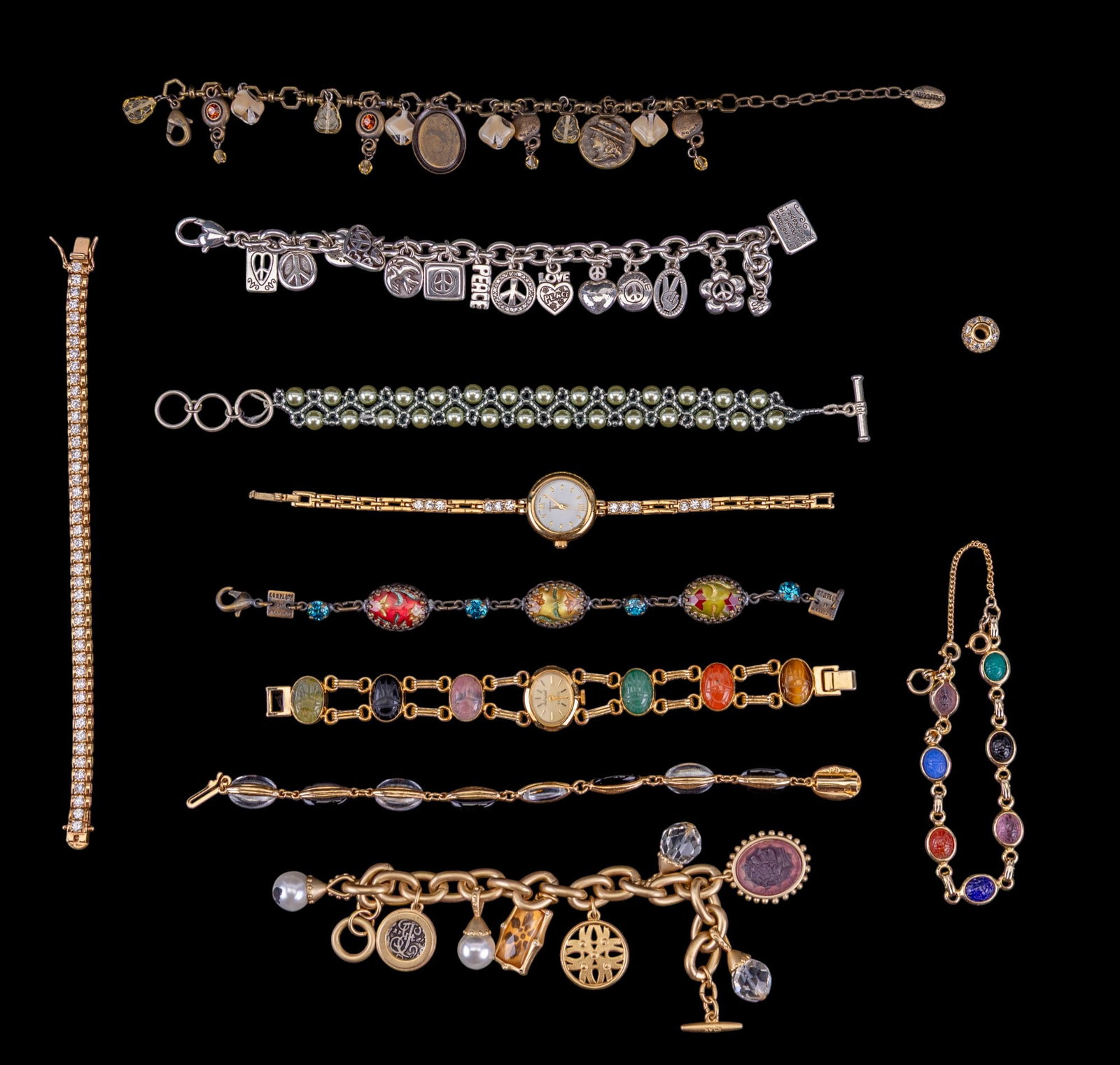 Ladies Wrist Watches and Charm Bracelets: A collection of ladies wrist watches and charm bracelets including an Admark scarab band wrist watch, a gold tone cubic zirconia tennis bracelet, and Anne Klein cameo and coin charm bracelet, a Bright