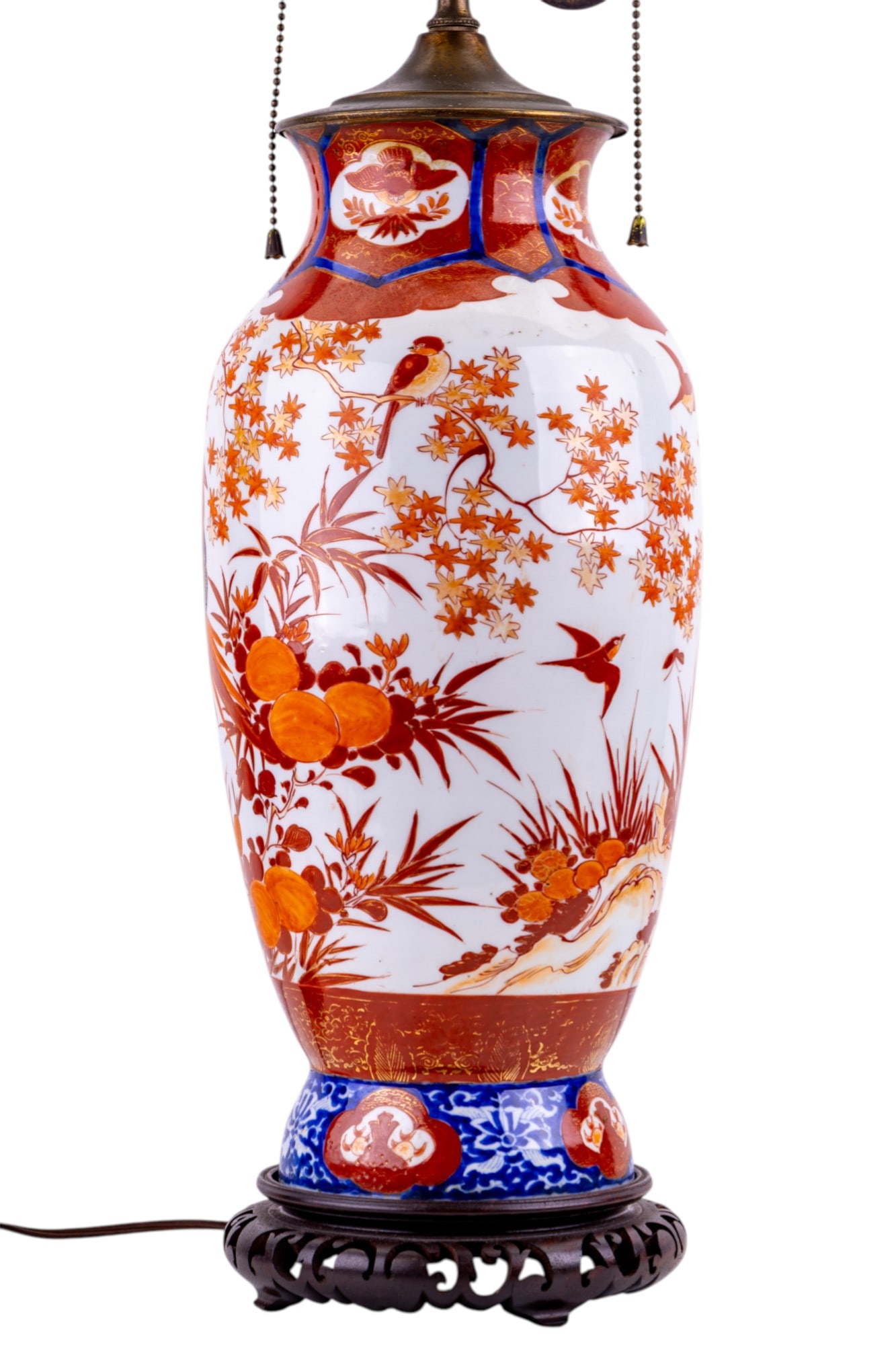 Antique Japanese Imari Porcelain Vase / Lamp: A Japanese Imari porcelain, converted to a lamp with a dual-socket brass fixture. Vase features traditional Imari palette colors. With hand painted with orange / red colors scenes of birds among maple