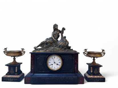 Antique French Neoclassical Mantel Clock Set: A 3 piece French garniture set featuring a figural mantel clock and matching side urns. Central clock showcases a cast metal figure of a seated classical woman, fitted with a round enamel dial and Rom