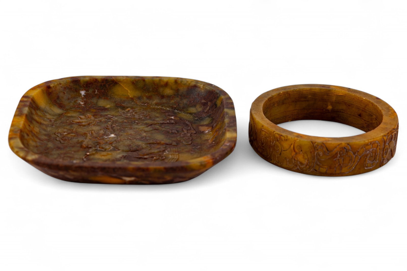 Carved Nephrite Hardstone Bangle and Dish: Carved nephrite hardstone bangle, approx. 3" diam x .75" H, and carved nephrite rounded square trinket dish with dragon relief motif, 4.75" W x 4.75" D x .5" H. Not signed.