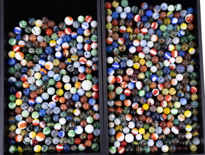 Large Collection of Marbles: A large collection of assorted vintage and contemporary marbles including a wide variety of colors, sizes, conditions, and patterns such as swirls, cat's eyes, agate-style, and clear glass types.